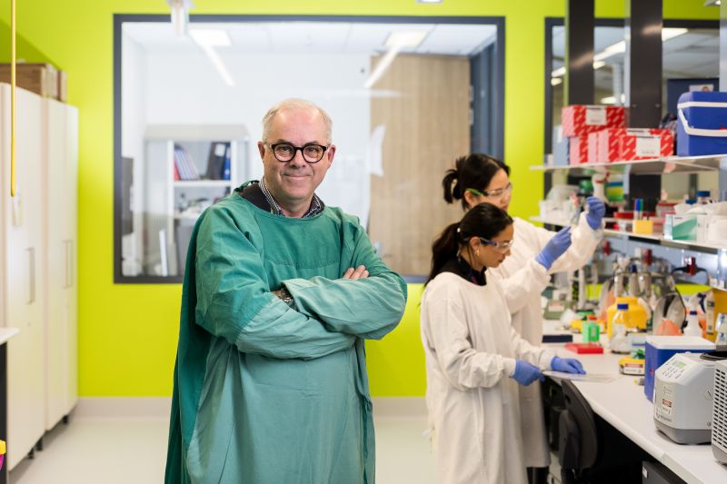 Chris Hovens standing in lab coat