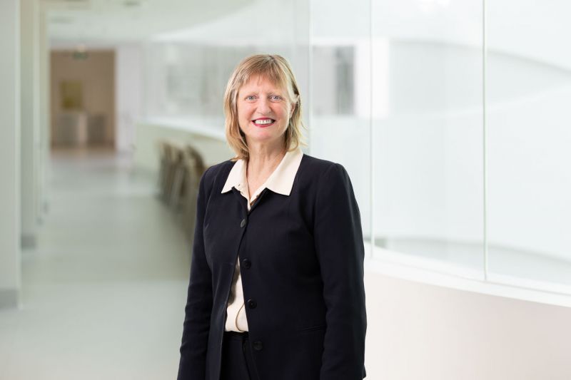Woman standing in front of a glass wall