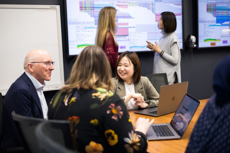 Team working together in board room